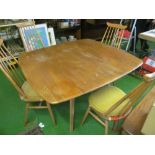An Ercol dropleaf table and four stick back chairs