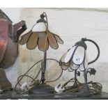 A cream and metal Tiffany style table lamp and a pair of similar smaller lamps