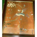 An early 20th Century Chinese silk embroidery exotic bird design framed, another circular bird and