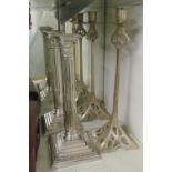 A pair plated candlesticks and another pair