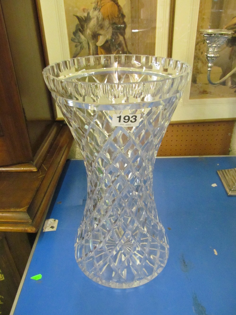 A tall cut glass vase