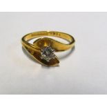 An 18ct gold diamond ring, size M 3.3gm