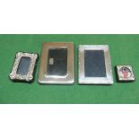 Four small silver frames