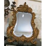 A Rococco style dressing table mirror with gilt frame