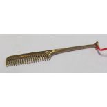 A small 9ct gold comb