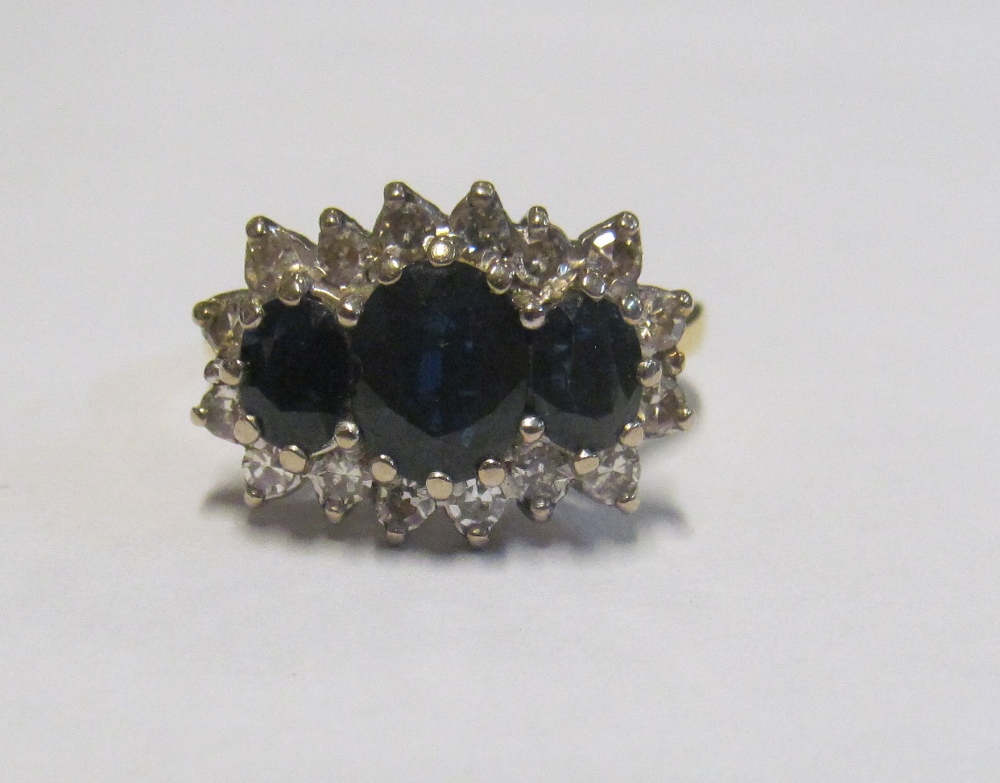 An 18ct gold sapphire and diamond ring, size N 6gm