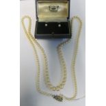 A cultured pearl necklace with 9ct white gold clasp and a pair of pearl earrings (i.c)