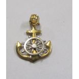 A gold coloured anchor and wheel pendant marked 14k (believed to be from Atocha Galleon)