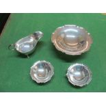 A silver sauceboat and three dishes 12oz
