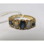 A 9ct gold opal and blue stone ring