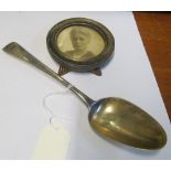 A Georgian silver spoon, small cicular silver frame and a plated salver