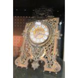 A Victorian brass cased mantel clock
