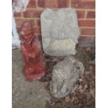 A garden ornament lion, another oriental figure and a plaque