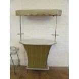 A retro 1960s bar with canopy and two bar stools