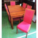 An Ercol table and six chairs with extra leaf