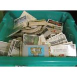 A green box of loose cigarette cards