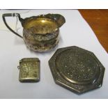 A small Victorian silver jug, a compact marked 900 and a vesta