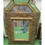 A decorative gilt wall mirror and octagonal mirror with mirror frame