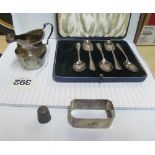 A silver napkin ring, silver jug and five silver teaspoons (i.c)