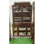 An Edwardian display cabinet with pagoda top