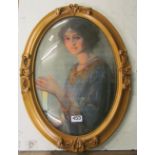 An oval portrait of lady in gilt frame