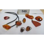 Three amber rings, two pendants, heart pendant and pendant on cord