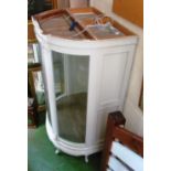 A large white painted and glass demi-lune display cabinet