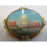 A Victorian oval pendant/brooch inset with watercolour of Taj Mahal (glass cracked)