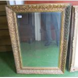 A rectangular gilt mirror