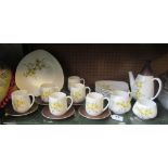 A Carlton Ware coffee set yellow and brown floral pattern six place setting with teapot, sucrier and