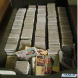 A tin of loose cigarette cards