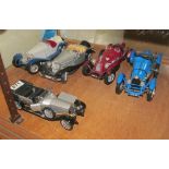 Four Burago and a Franklin Mint vintage car