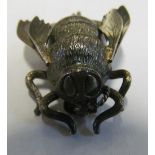A silver coloured bee brooch (one antennae a/f)