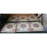 A set of six Graves Dunhill & Co floral design tiles