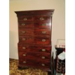 A 19th Century mahogany chest on chest with secretaire drawer blind fret decoration