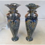 A pair of Doulton Lambeth vases, twin handles and blue ground by Mark V Marshall (both upper