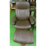 A Stressless recliner armchair and stool
