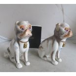 A pair of Sutherland Bone China for National Trust pug dogs based on ones from Saltram House,