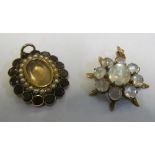 A Victorian seed pearl and garnet hair locket pendant and a moonstone pendant