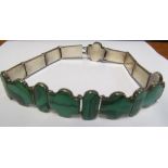 A malachite chocker necklace together with a malachite bangle and ring
