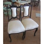 An Edwardian salon suite armchair, four matching side chairs andnot matching a tub shaped chair