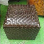 A brown leather style cube seat