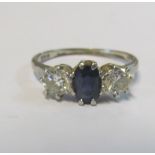 A platinum sapphire and diamond three stone ring, 3.3g size D
