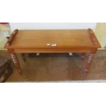 A Victorian mahogany bench seat on turned supports