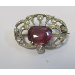 A pretty Edwardian diamond and red stone (synthetic)brooch