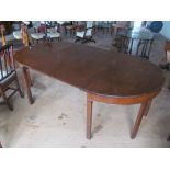 A George III mahogany extending dining table