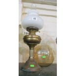 An Atsonia freestanding mirror, oil lamp and glass bowl