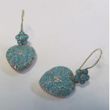 A pair gold coloured heart shaped turquoise earrings with diamond centre