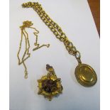 A Victorian yellow metal brooch set amethyst coloured stones, chain and a Victorian locket on chain