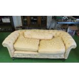 An Edwardian Chesterfield style button upholstered settee